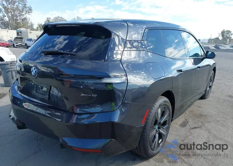 2025 BMW Ix xDrive50 из США, поврежденный, VIN WB523CF00SCS58721